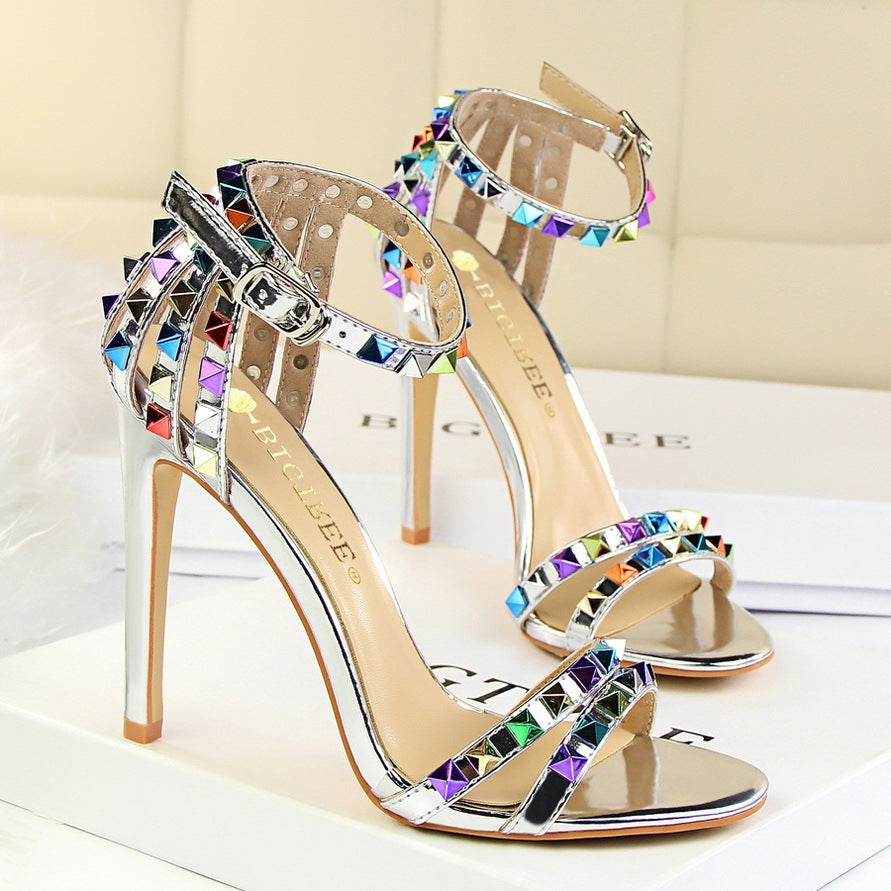 Open-toe sandals with cutout colorful studs